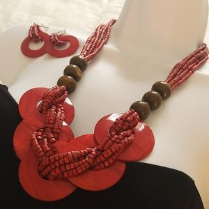 Beaded red necklace with matching earrings.